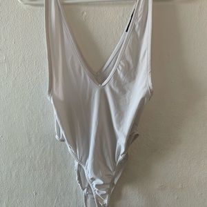 Plunging white body suit